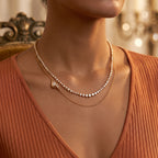 Pretty Shimmering Things Emery double-layer gold-tone necklace with sparkling zircon stones on a model