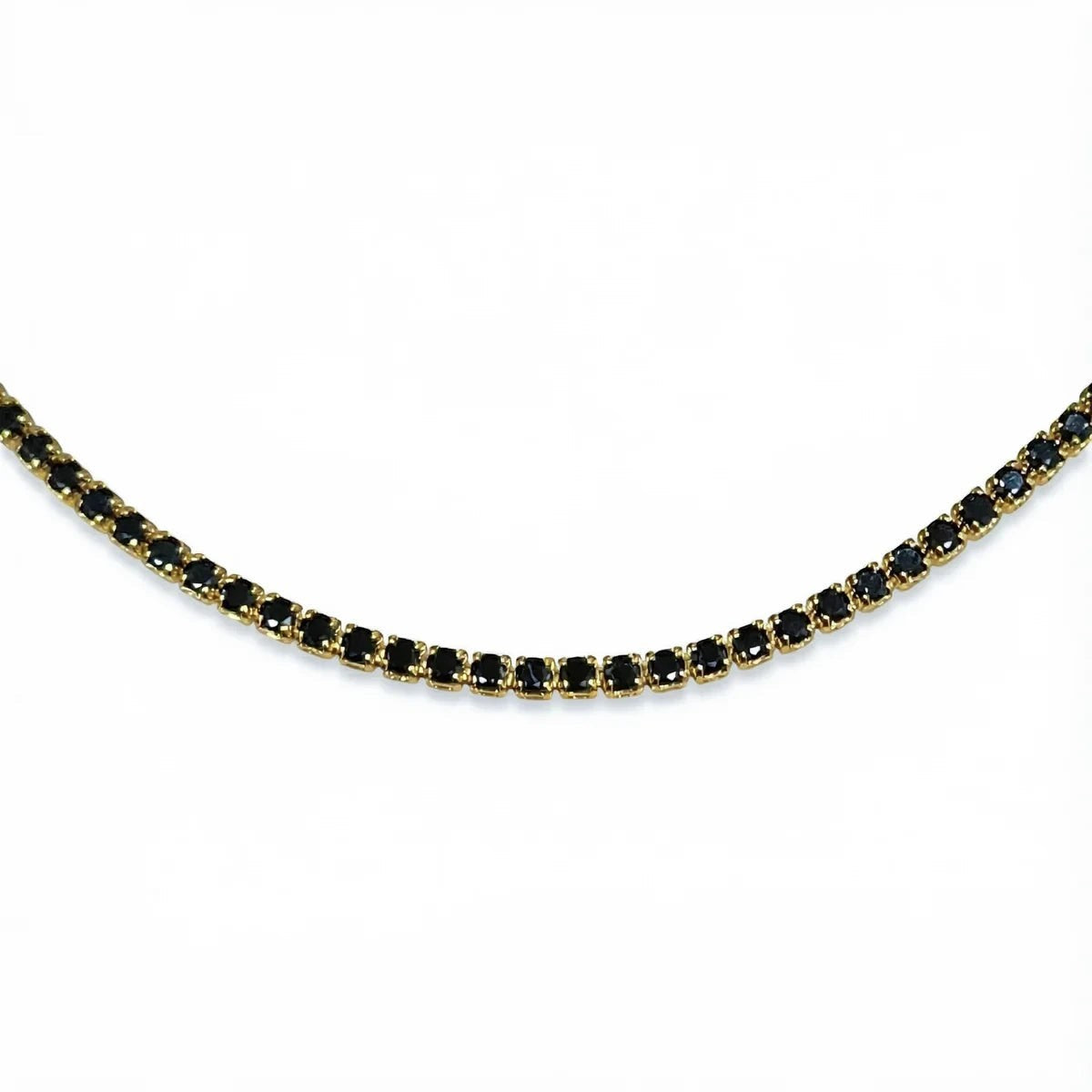 Pretty Shimmering Things Global gold-tone tennis necklace featuring a row of sparkling jet black crystals.