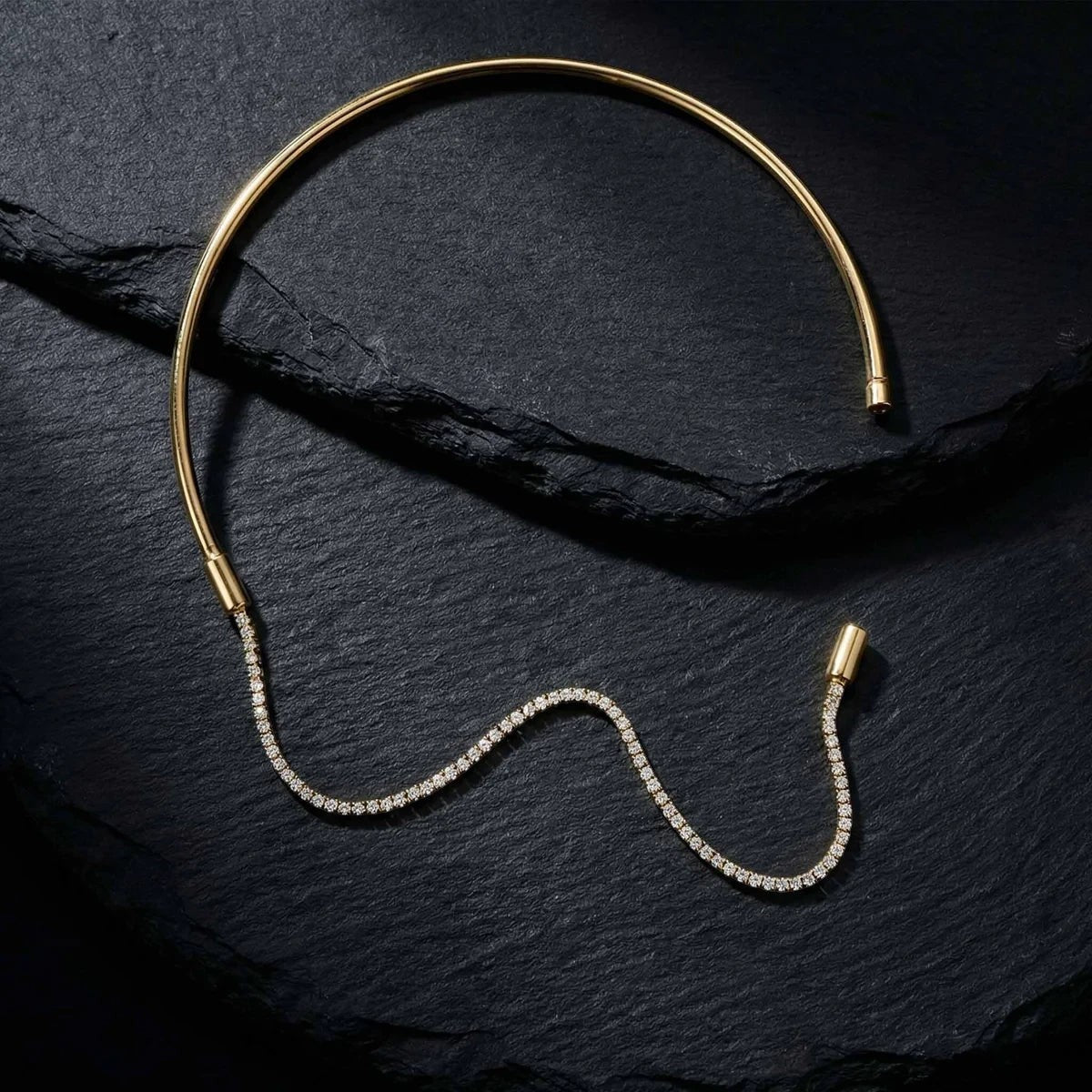 Pretty Shimmering Things Global gold-tone rigid collar necklace with a detachable sparkling crystal tennis chain.