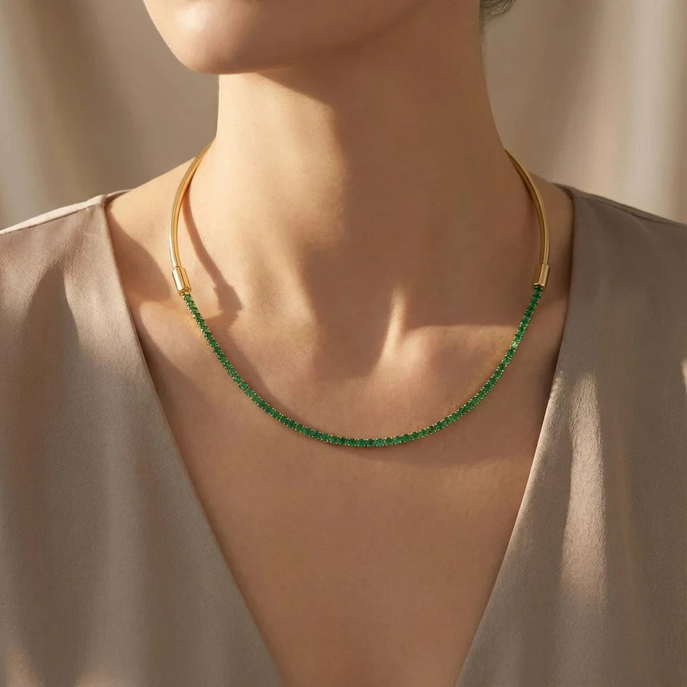 Pretty Shimmering Things Global gold-tone collar necklace with an interchangeable emerald green crystal tennis chain.