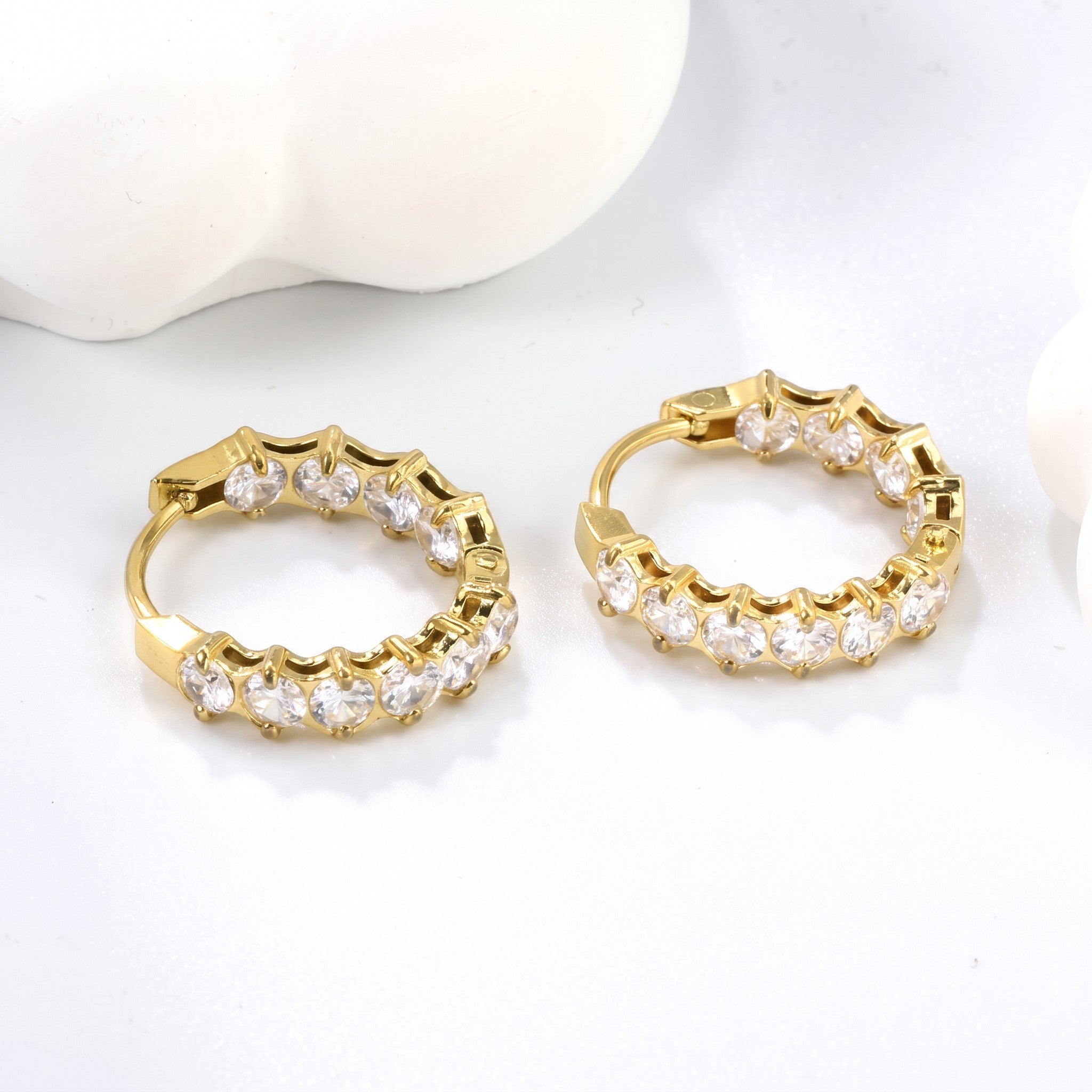 Pretty Shimmering Things Global Lyra crystal hoop clips in 18K gold-plated stainless steel with zircon stones.