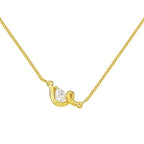 Pretty Shimmering Things Global gold-tone layered necklace featuring a sculptural clasp and a teardrop crystal pendant.