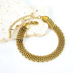 Pretty Shimmering Things Global gold-tone multi-strand woven chain bracelet in stainless steel with lobster clasp