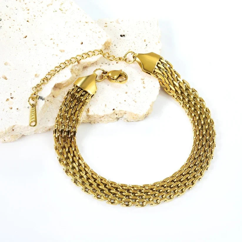 Pretty Shimmering Things Global gold-tone multi-strand woven chain bracelet in stainless steel with lobster clasp