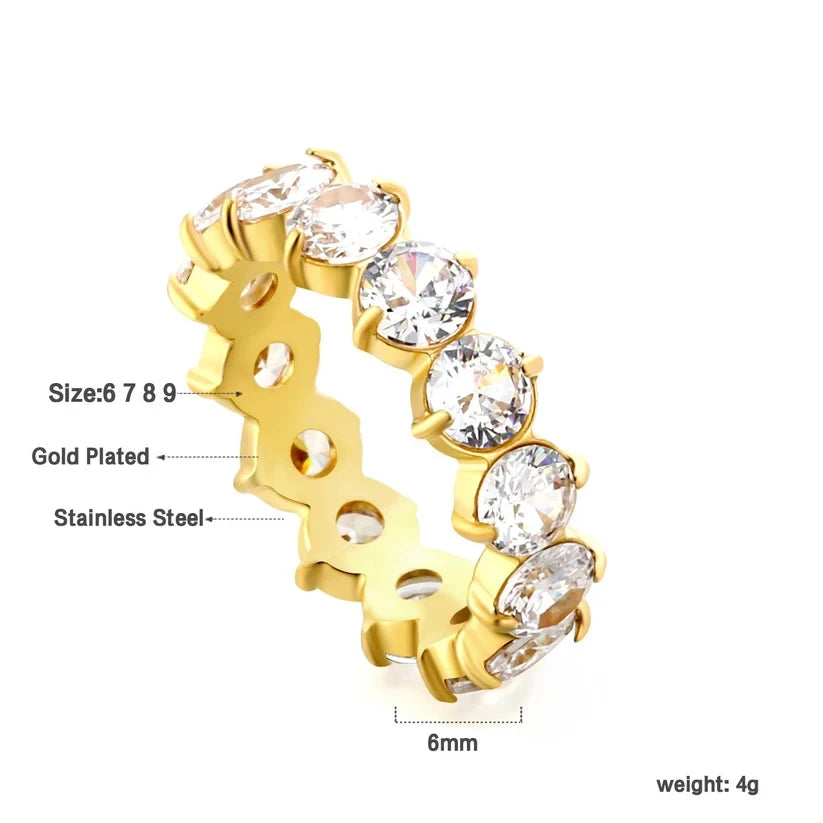 Pretty Shimmering Things Global gold-plated stainless steel eternity band with sparkling white 5A zircon stones.