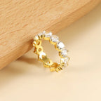 Pretty Shimmering Things Global Ivy white stone band featuring 18K gold plated stainless steel and 5A zircon stones.