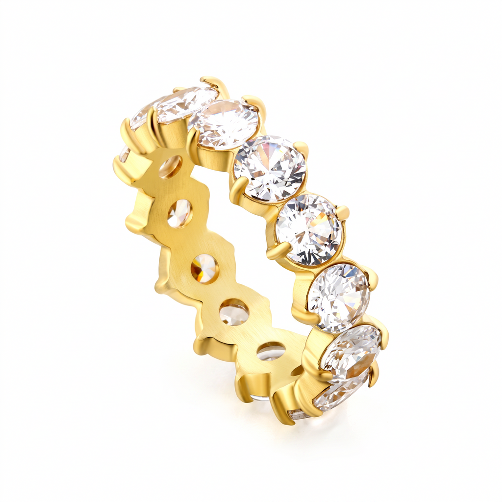Pretty Shimmering Things Global gold-plated eternity ring featuring a row of sparkling white 5A zircon stones.