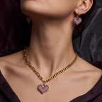 Pretty Shimmering Things Global Chloe heart charm set featuring gold-tone chain necklace and matching heart earrings.