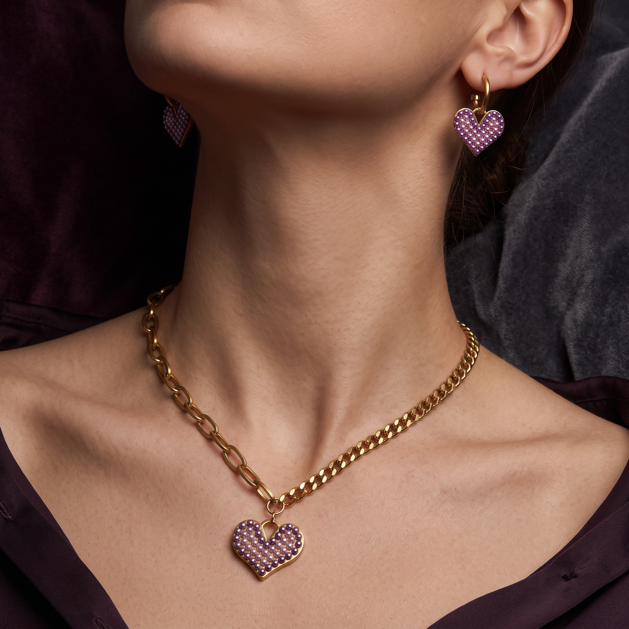 Pretty Shimmering Things Global Chloe heart charm set featuring gold-tone chain necklace and matching heart earrings.