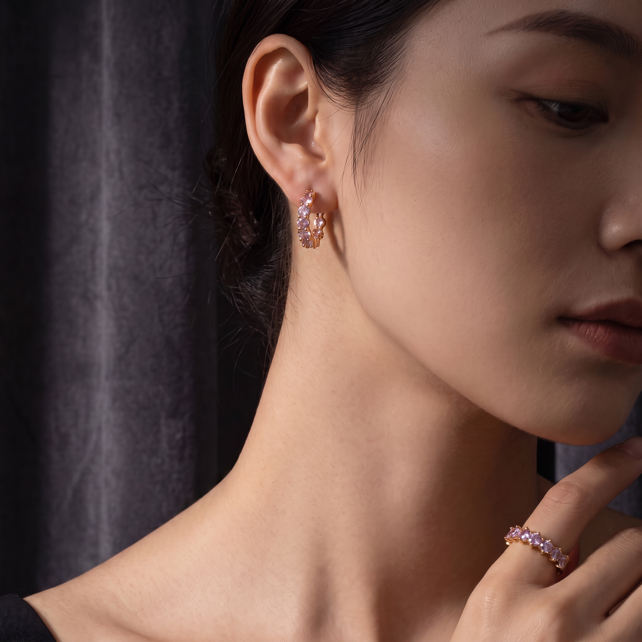 Pretty Shimmering Things Global Lyra lavender zircon hoop ear clips and matching ring worn by a woman