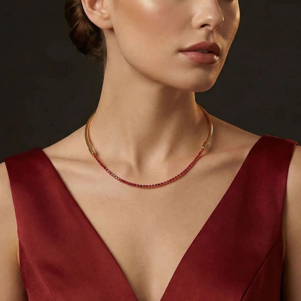 Pretty Shimmering Things Global convertible gold-tone collar necklace with a ruby red crystal tennis chain attachment.