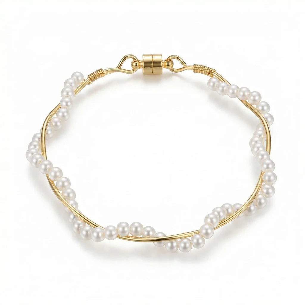 Pretty Shimmering Things Global twisted pearl bracelet with white pearls and gold-tone wire featuring a magnetic clasp