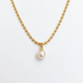 Pretty Shimmering Things gold-toned beaded chain necklace with a single lustrous white pearl pendant.