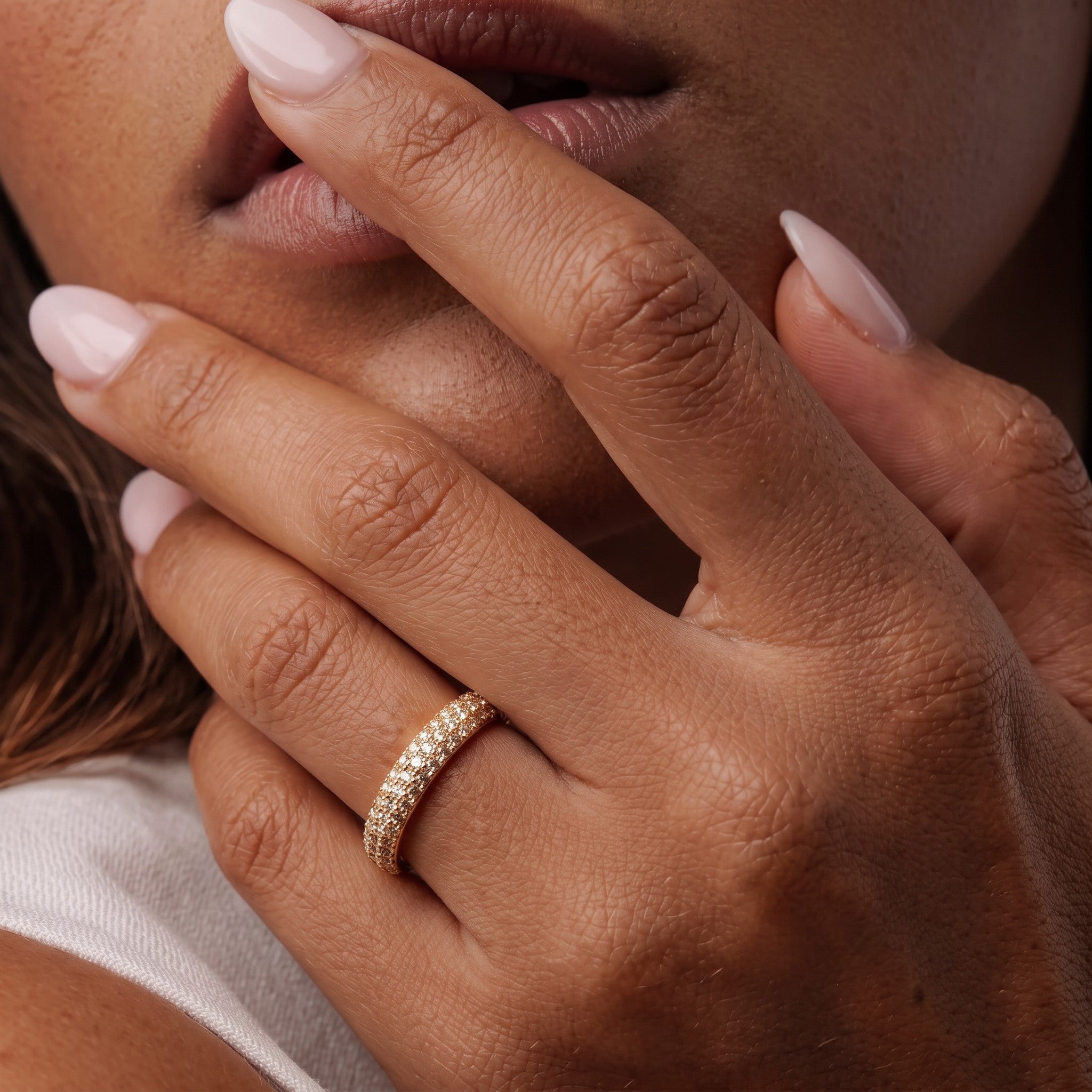Pretty Shimmering Things Camille Gleam gold-tone brass ring with crystal accents worn on a woman's finger