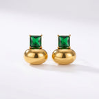 Pretty Shimmering Things gold-tone stud earrings featuring a polished metallic base and a square-cut emerald green crystal.