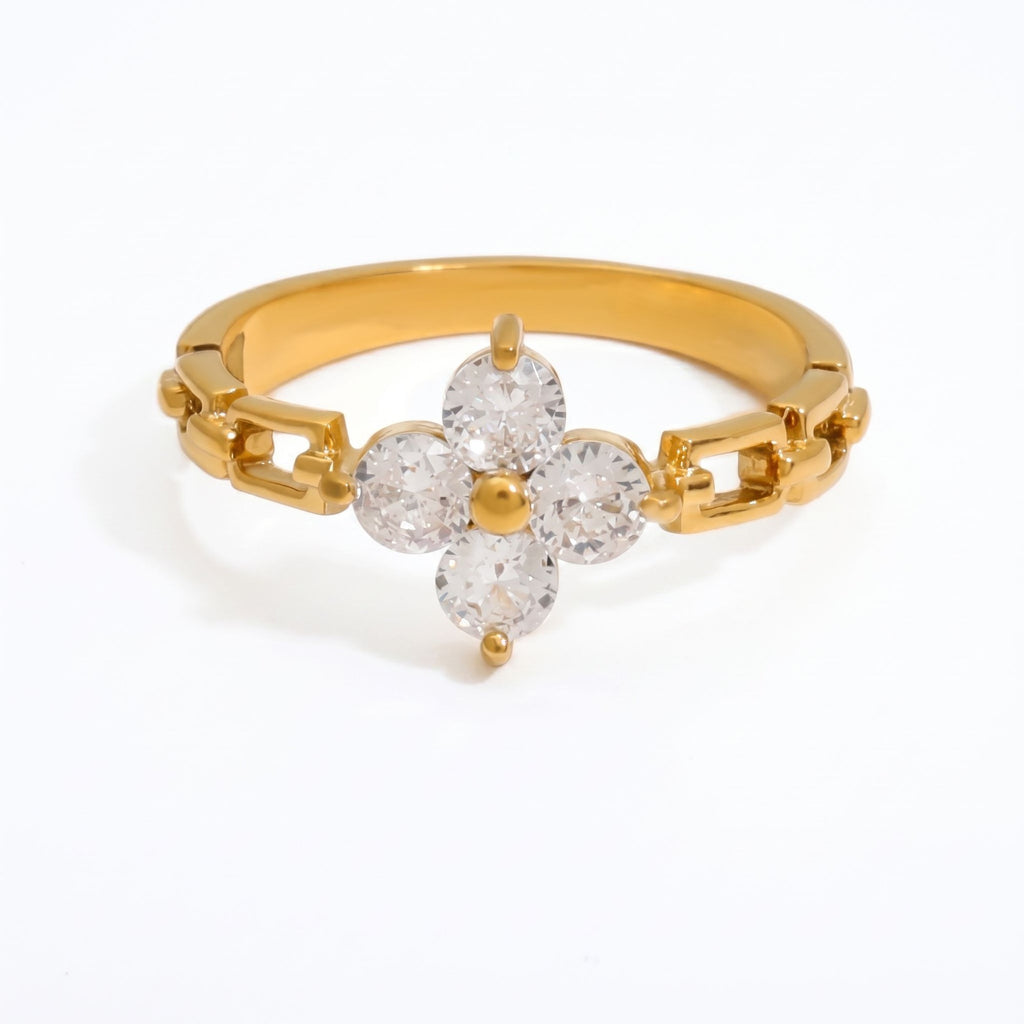 Pretty Shimmering Things gold-tone floral ring with clear cubic zirconia petals and a unique chain-link band design.