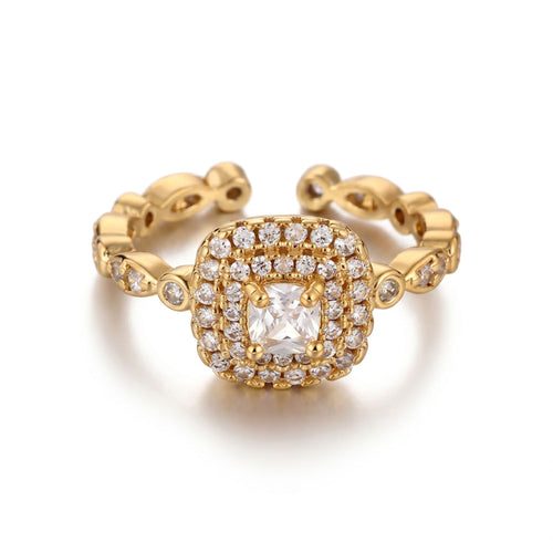 Pretty Shimmering Things gold-tone adjustable halo ring with a cushion-cut center stone and sparkling cubic zirconia.