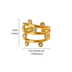 Pretty Shimmering Things gold-tone multi-layered statement ring with textured bands and bezel-set crystal accents.