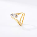 Pretty Shimmering Things gold-tone statement ring featuring an elongated marquise-cut solitaire stone and open shank.