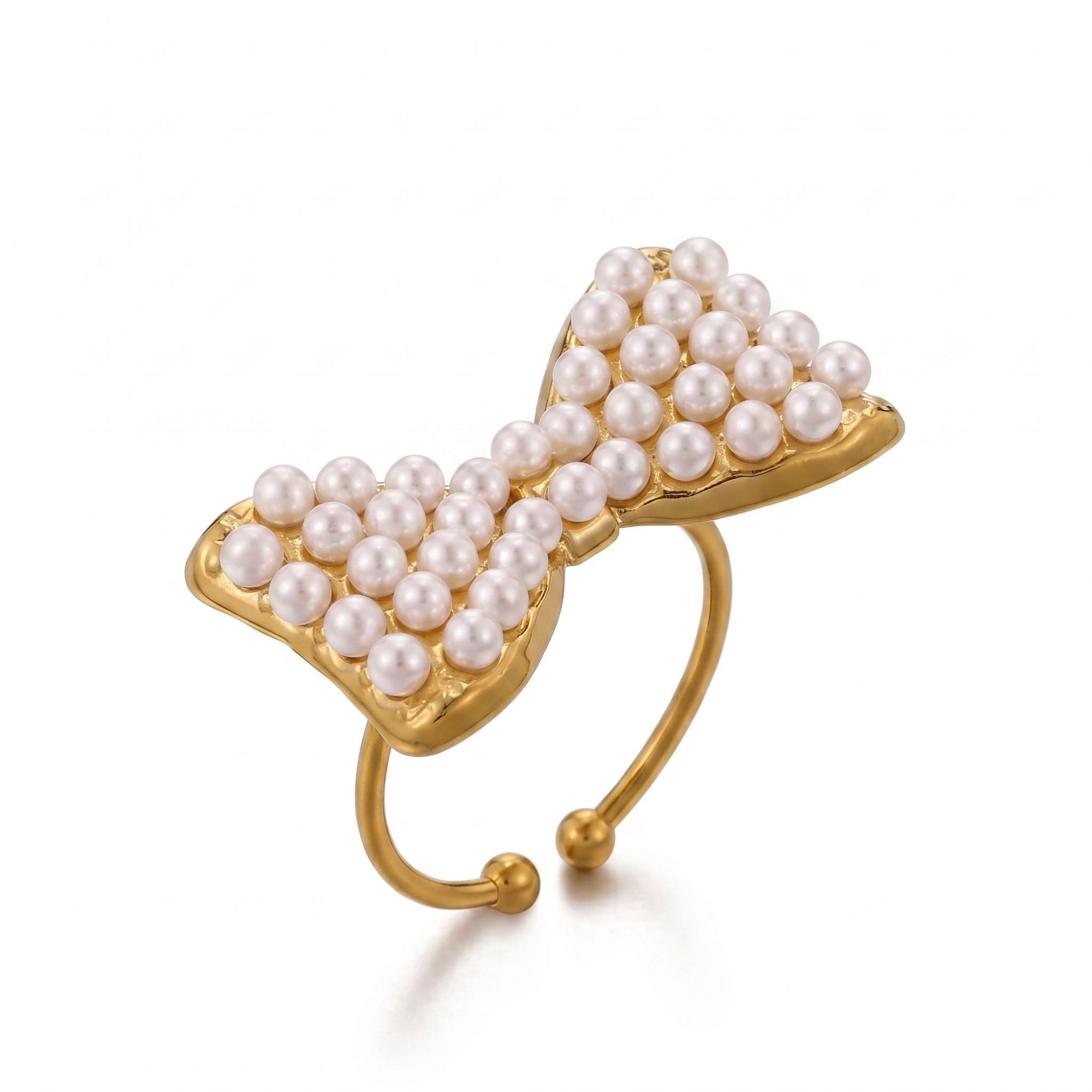 Pretty Shimmering Things gold-tone bow statement ring featuring delicate faux pearls on an adjustable open band.