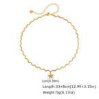 Pretty Shimmering Things gold-tone wavy chain necklace with a dainty matte floral pendant and central crystal accent.